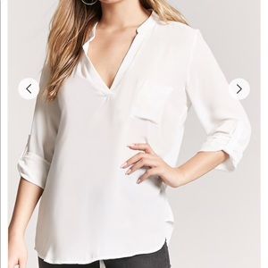 Quarter length white v neck blouse